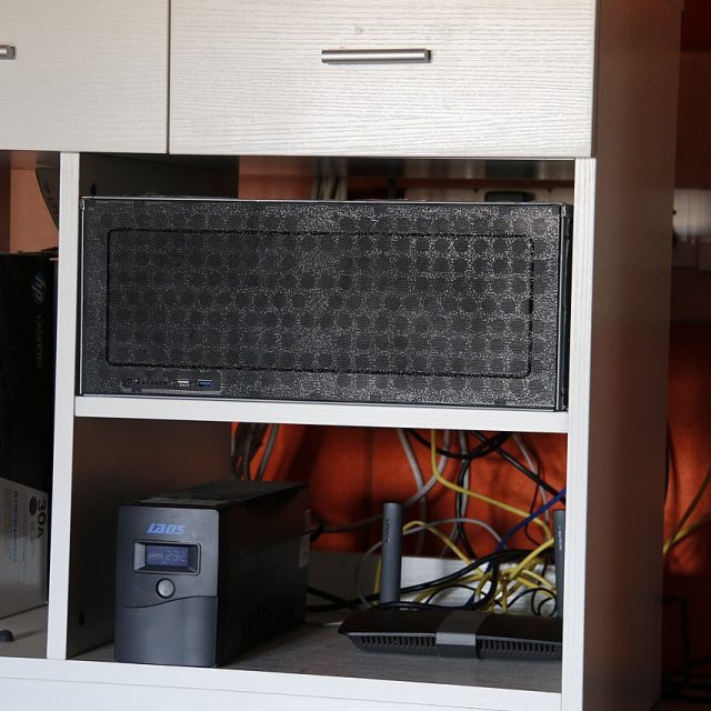 Home lab server, UPS and router on a shelf