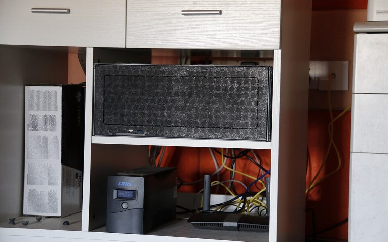 Home lab server, UPS and router on a shelf
