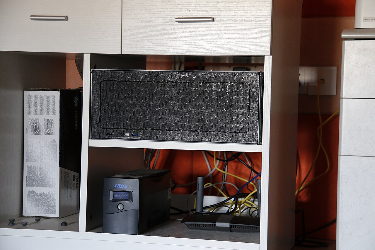 Home lab server, UPS and router on a shelf