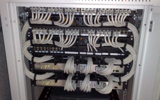 Rackmount Ethernet switches connected to patch panels