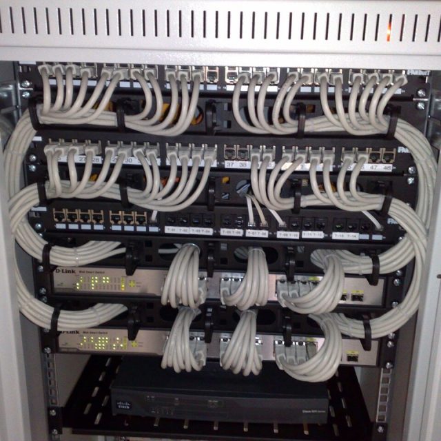 Rackmount Ethernet switches connected to patch panels