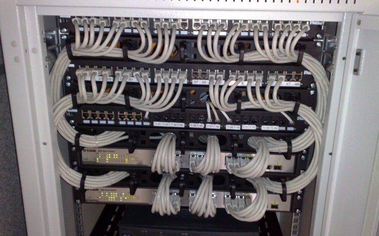 Rackmount Ethernet switches connected to patch panels