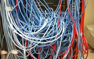 Rack with a tangled mass of undocumented network cables